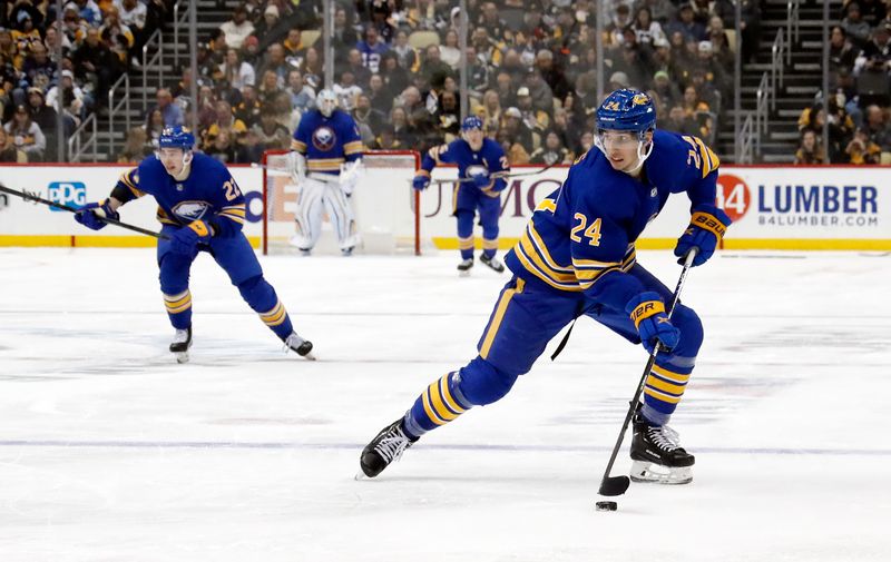 Dec 10, 2022; Pittsburgh, Pennsylvania, USA; Buffalo Sabres center Dylan Cozens (24) skates into the offensive zone with the puck against the Pittsburgh Penguins during the second period at PPG Paints Arena. The Penguins won 3-1.  Mandatory Credit: Charles LeClaire-USA TODAY Sports