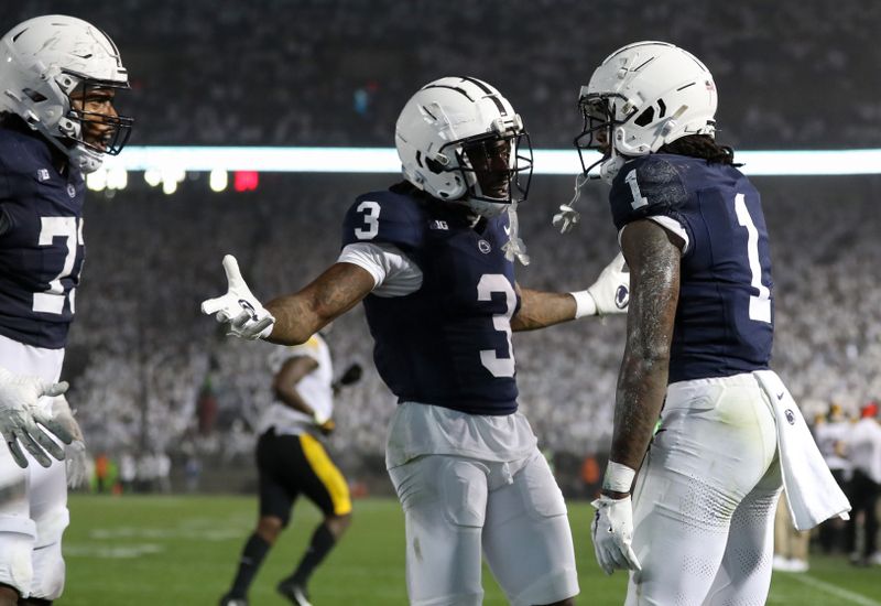 Sep 23, 2023; University Park, Pennsylvania, USA; Penn State Nittany Lions wide receiver KeAndre Lambert-Smith (1) celebrates with teammates after scoring a touchdown during the fourth quarter against the Iowa Hawkeyes at Beaver Stadium. Penn State defeated Iowa 31-0. Mandatory Credit: Matthew O'Haren-USA TODAY Sports