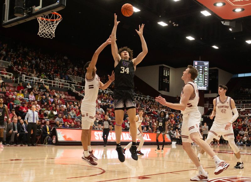 Feb 26, 2023; Stanford, California, USA; Washington Huskies center Braxton Meah (34) vies for a rebound with Stanford Cardinal forward Brandon Angel (left) and Stanford Cardinal guard Michael Jones (13) during the second half at Maples Pavilion. Mandatory Credit: D. Ross Cameron-USA TODAY Sports