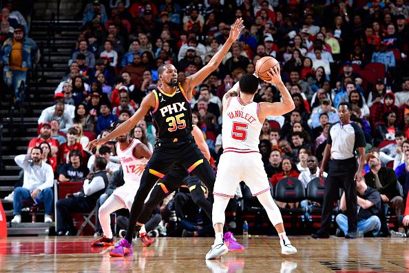 HOUSTON, TX - DECEMBER 27:   Kevin Durant #35 of the Phoenix Suns plays defense against Fred VanVleet #5 of the Houston Rockets on December 27, 2023 at the Toyota Center in Houston, Texas. NOTE TO USER: User expressly acknowledges and agrees that, by downloading and or using this photograph, User is consenting to the terms and conditions of the Getty Images License Agreement. Mandatory Copyright Notice: Copyright 2023 NBAE (Photo by Logan Riely/NBAE via Getty Images)