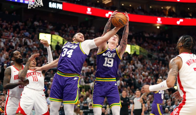 SALT LAKE CITY, UT - APRIL 11: Kenneth Lofton Jr., #34 and Luka Samanic #19 of the Utah Jazz grab for a rebound against Cam Whitmore #7, Jabari Smith. Jr., #10 and Jeff Green #32 of Houston Rockets  during the second half of their game at the Delta Center on April 11, 2024 in Salt Lake City, Utah. NOTE TO USER: User expressly acknowledges and agrees that, by downloading and or using this photograph, User is consenting to the terms and conditions of the Getty Images License Agreement. Photo by Chris Gardner/Getty Images)