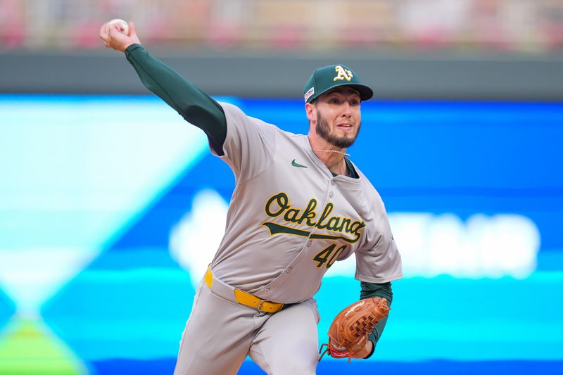 Jun 14, 2024; Minneapolis, Minnesota, USA; Oakland Athletics pitcher Mitch Spence (40) pitches against the Minnesota Twins in the second inning at Target Field. Mandatory Credit: Brad Rempel-USA TODAY Sports