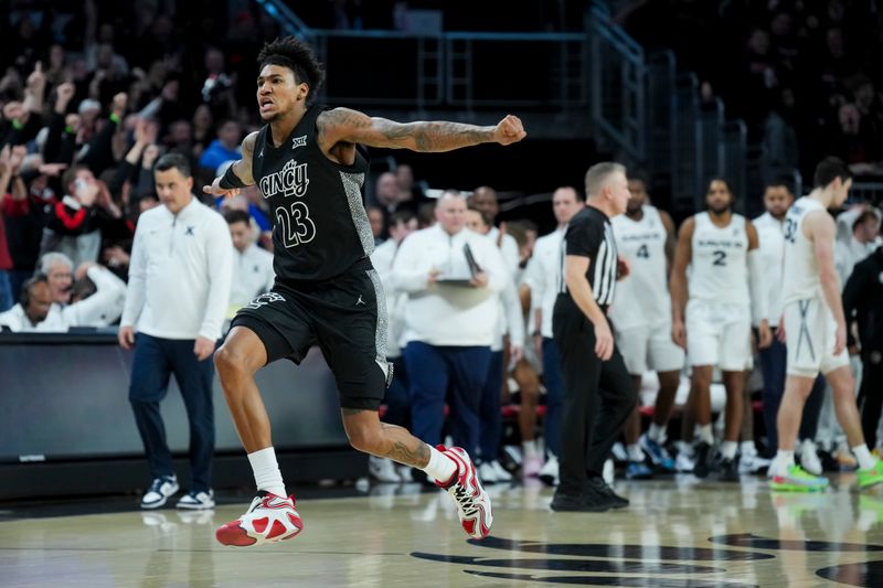 Dec 14, 2024; Cincinnati, Ohio, USA; Cincinnati Bearcats forward Dillon Mitchell (23) reacts to defeating the Xavier Musketeers as time expires in the second half at Fifth Third Arena. Mandatory Credit: Aaron Doster-Imagn Images