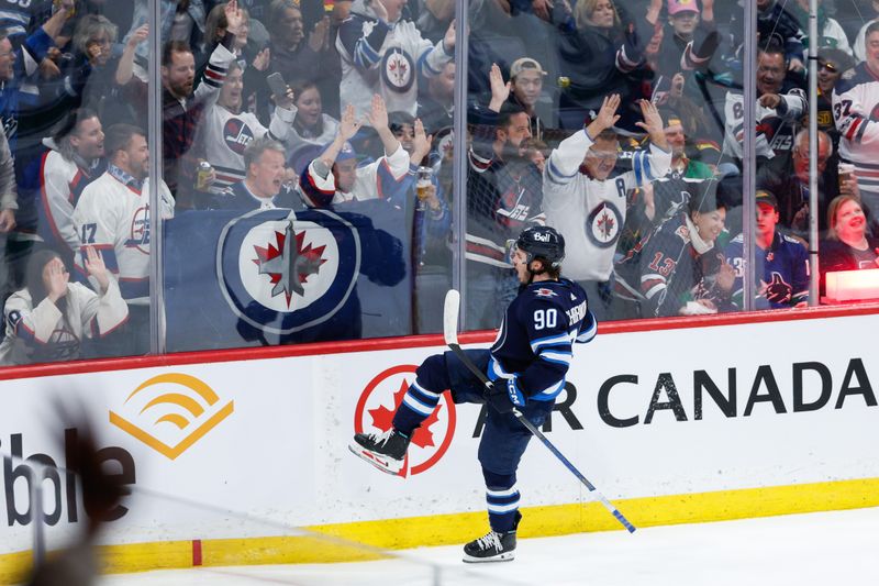 Apr 18, 2024; Winnipeg, Manitoba, CAN;  Winnipeg Jets forward Nikita Chibrikov (90) celebrates his first NHL goal against the Vancouver Canucks during the third period at Canada Life Centre. Mandatory Credit: Terrence Lee-USA TODAY Sports