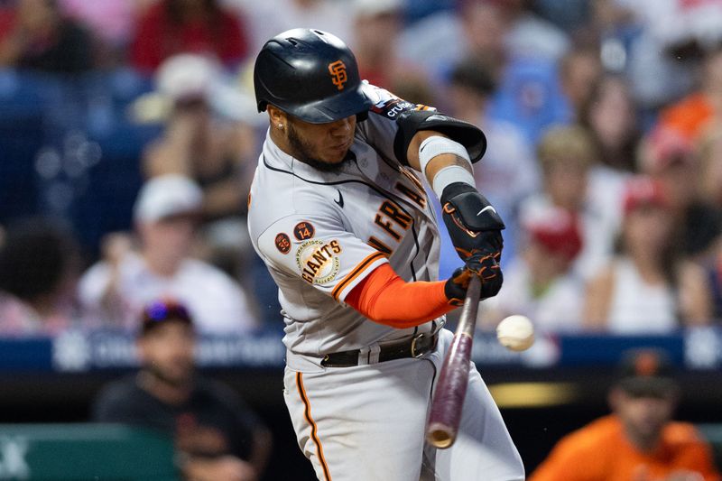 Aug 23, 2023; Philadelphia, Pennsylvania, USA; San Francisco Giants second baseman Thairo Estrada (39) hits an RBI fielder choice during the tenth inning against the Philadelphia Phillies at Citizens Bank Park. Mandatory Credit: Bill Streicher-USA TODAY Sports