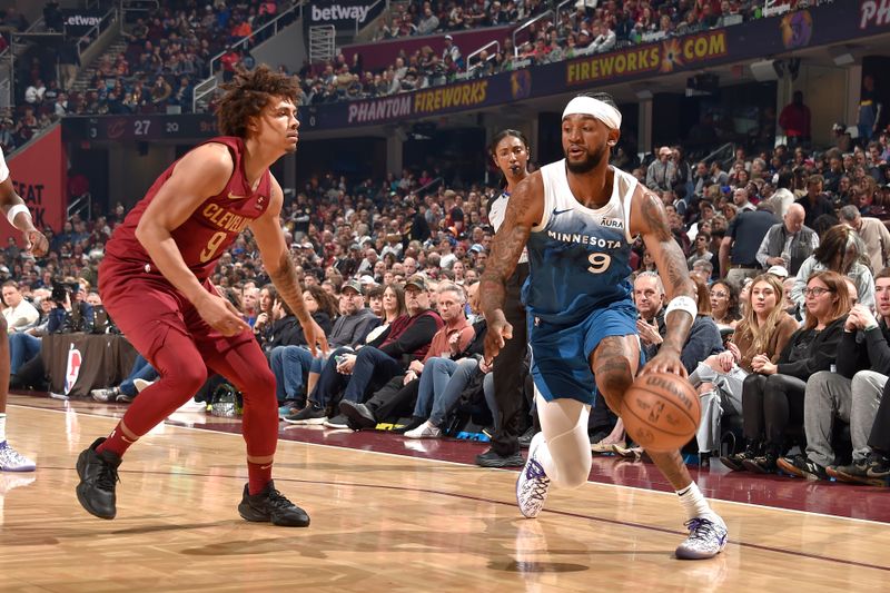 CLEVELAND, OH - MARCH 8: Nickeil Alexander-Walker #9 of the Minnesota Timberwolves handles the ball during the game against the Cleveland Cavaliers on March 8, 2024 at Rocket Mortgage FieldHouse in Cleveland, Ohio. NOTE TO USER: User expressly acknowledges and agrees that, by downloading and/or using this Photograph, user is consenting to the terms and conditions of the Getty Images License Agreement. Mandatory Copyright Notice: Copyright 2024 NBAE (Photo by David Liam Kyle/NBAE via Getty Images)