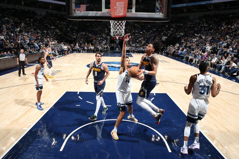 MINNEAPOLIS, MN -  OCTOBER 17: Julian Strawther #3 of the Denver Nuggets drives to the basket during the game against the Minnesota Timberwolves during the 2024 NBA Preseason on October 17, 2024 at Target Center in Minneapolis, Minnesota. NOTE TO USER: User expressly acknowledges and agrees that, by downloading and or using this Photograph, user is consenting to the terms and conditions of the Getty Images License Agreement. Mandatory Copyright Notice: Copyright 2024 NBAE (Photo by David Sherman/NBAE via Getty Images)