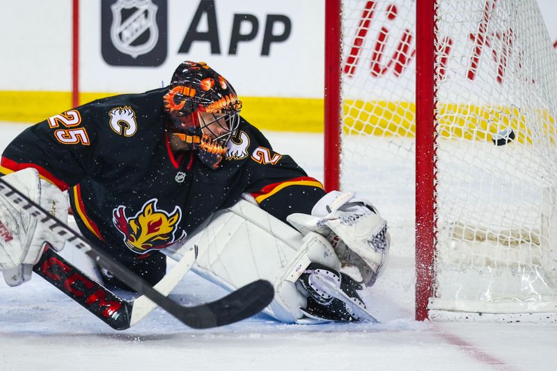 Apr 2, 2024; Calgary, Alberta, CAN; Calgary Flames goaltender Jacob Markstrom (25) reacts to the goal by Anaheim Ducks right wing Troy Terry (not pictured) during the second period at Scotiabank Saddledome. Mandatory Credit: Sergei Belski-USA TODAY Sports