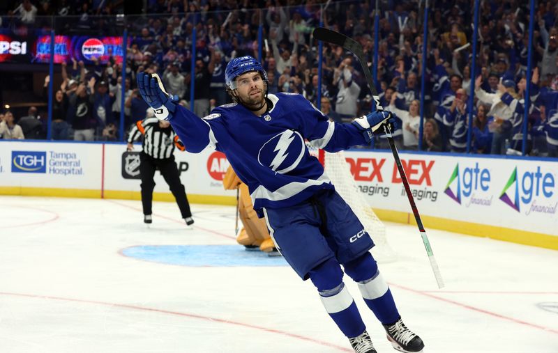 Oct 10, 2023; Tampa, Florida, USA; Tampa Bay Lightning left wing Brandon Hagel (38) scores a goal on a penalty  shot during the third period against the Nashville Predators at Amalie Arena. Mandatory Credit: Kim Klement Neitzel-USA TODAY Sports