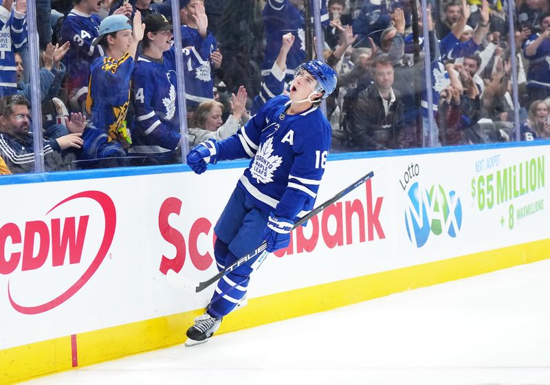 Oct 12, 2024; Toronto, Ontario, CAN; Toronto Maple Leafs right wing Mitch Marner (16) reacts after scoring a goal against the Pittsburgh Penguins during the third period at Scotiabank Arena. Mandatory Credit: Nick Turchiaro-Imagn Images