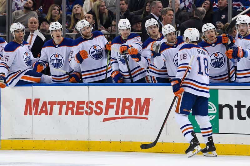 Dec 22, 2023; New York, New York, USA;  Edmonton Oilers left wing Zach Hyman (18) celebrates his goal against the New York Rangers during the third period at Madison Square Garden. Mandatory Credit: Dennis Schneidler-USA TODAY Sports