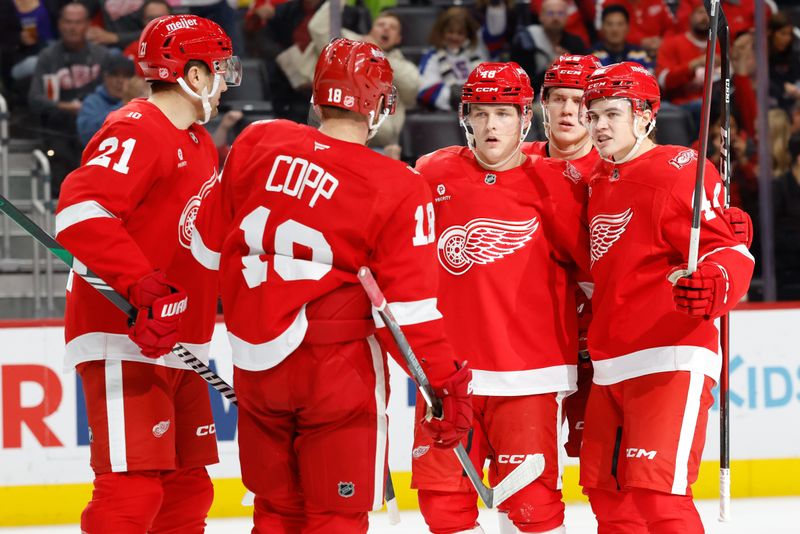 Oct 25, 2025; Detroit, Michigan, USA;  Detroit Red Wings right wing Jonatan Berggren (48) receives congratulations from teammates after scoring in the second period against the St. Louis Blues at Little Caesars Arena. Mandatory Credit: Rick Osentoski-Imagn Images