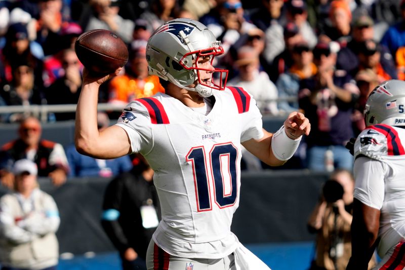 New England Patriots quarterback Drake Maye passes during the first half of an NFL football game against the Chicago Bears on Sunday, Nov. 10, 2024, in Chicago. (AP Photo/Nam Y. Huh)