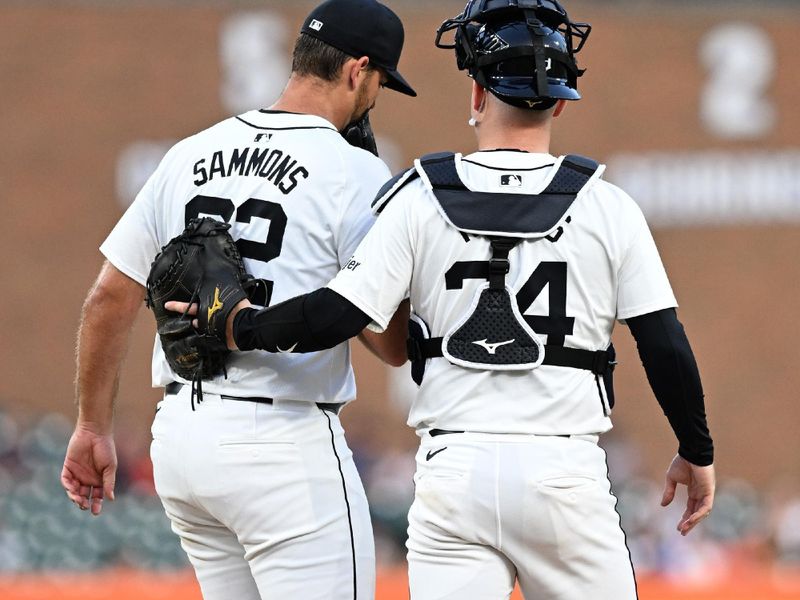 Aug 14, 2024; Detroit, Michigan, USA;  Detroit Tigers catcher Jake Rogers (34) talks to pitcher Bryan Sammons (62) between batters against the Seattle Mariners in the seventh inning at Comerica Park. Mandatory Credit: Lon Horwedel-USA TODAY Sports