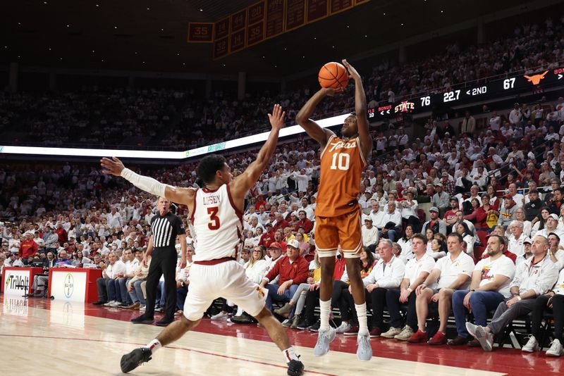 Jan 17, 2023; Ames, Iowa, USA; Iowa State Cyclones guard Tamin Lipsey (3) defends the shot from Texas Longhorns guard Sir'Jabari Rice (10) during the second half at James H. Hilton Coliseum. Mandatory Credit: Reese Strickland-USA TODAY Sports