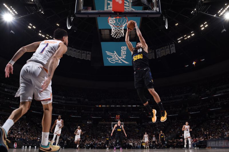 DENVER, CO - MARCH 27: Aaron Gordon #50 of the Denver Nuggets dunks the ball during the game against the Phoenix Suns on March 27, 2023 at the Ball Arena in Denver, Colorado. NOTE TO USER: User expressly acknowledges and agrees that, by downloading and/or using this Photograph, user is consenting to the terms and conditions of the Getty Images License Agreement. Mandatory Copyright Notice: Copyright 2024 NBAE (Photo by Garrett Ellwood/NBAE via Getty Images)