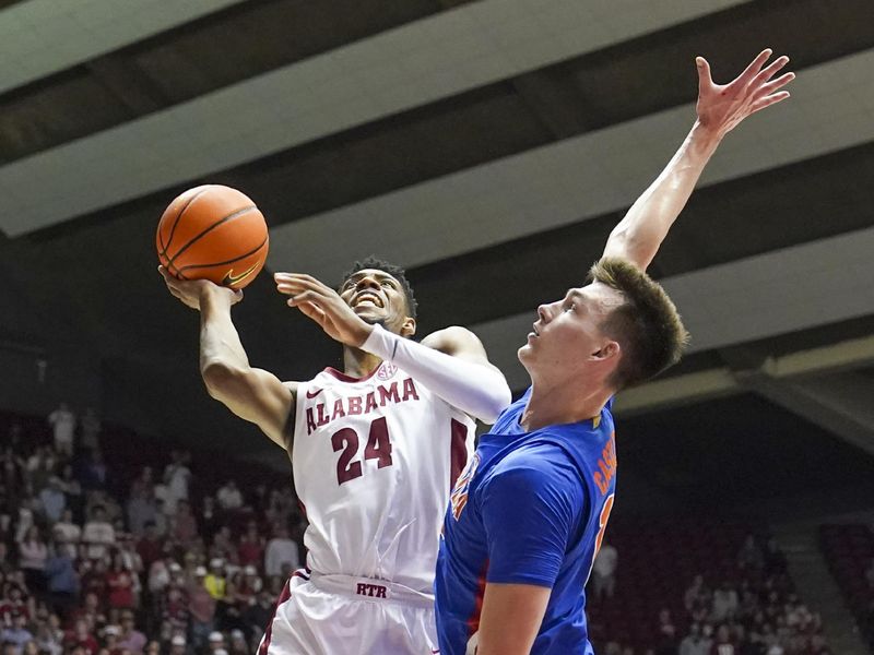 Feb 8, 2023; Tuscaloosa, Alabama, USA; Alabama Crimson Tide forward Brandon Miller (24) shoots against Florida Gators forward Colin Castleton (12) during the second half at Coleman Coliseum. Mandatory Credit: Marvin Gentry-USA TODAY Sports