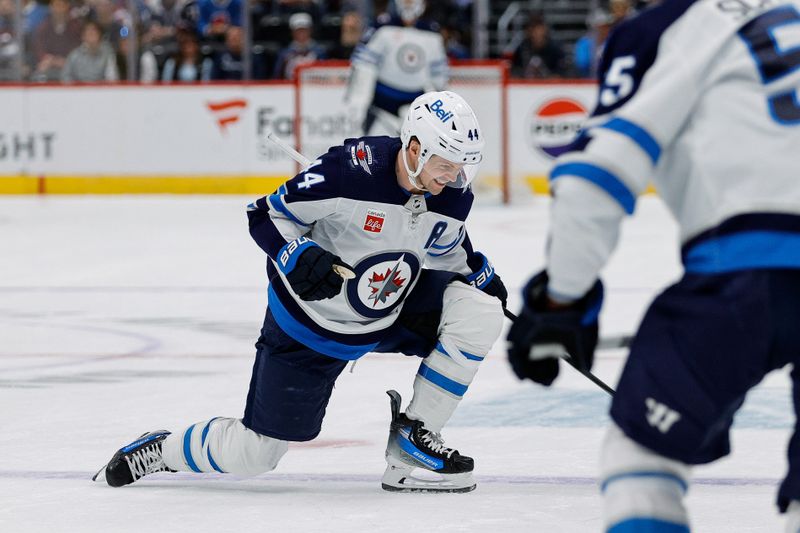 Apr 13, 2024; Denver, Colorado, USA; Winnipeg Jets defenseman Josh Morrissey (44) celebrates after his goal in the first period against the Colorado Avalanche at Ball Arena. Mandatory Credit: Isaiah J. Downing-USA TODAY Sports