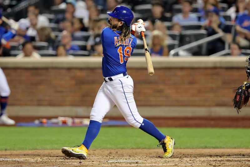 Aug 14, 2023; New York City, New York, USA; New York Mets second baseman Jonathan Arauz (19) follows through on a two run home run against the Pittsburgh Pirates during the fourth inning at Citi Field. Mandatory Credit: Brad Penner-USA TODAY Sports