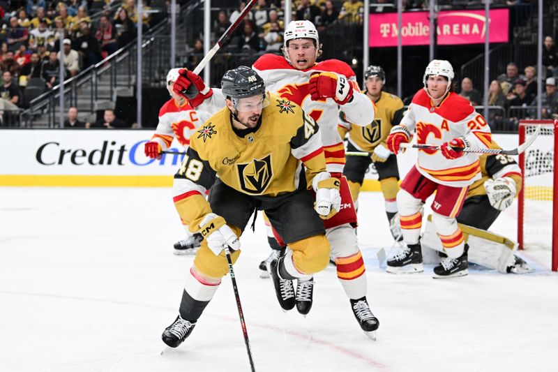 Oct 28, 2024; Las Vegas, Nevada, USA; Vegas Golden Knights center Tomas Hertl (48) and Calgary Flames center Connor Zary (47) in the third period at T-Mobile Arena. Mandatory Credit: Candice Ward-Imagn Images