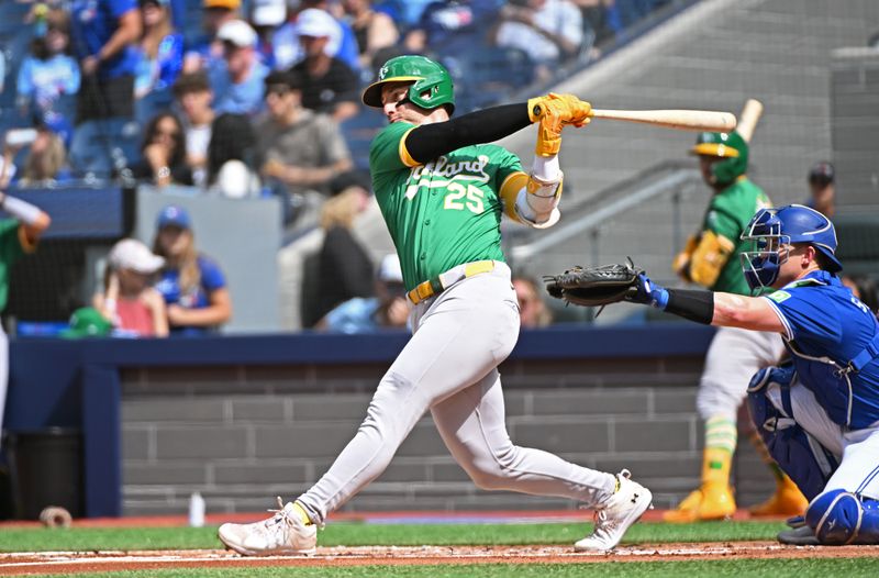 Aug 10, 2024; Toronto, Ontario, CAN; Oakland Athletics designated hitter Brent Rooker (25) hits a single in the first inning against the Toronto Blue Jays at Rogers Centre. Mandatory Credit: Gerry Angus-USA TODAY Sports