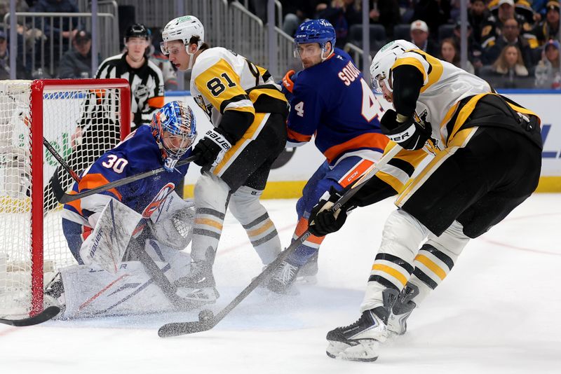 Feb 3, 2026; Elmont, New York, USA; Pittsburgh Penguins right wing Justin Brazeau (16) shoots the puck against New York Islanders goaltender Ilya Sorokin (30) and defenseman Carson Soucy (4) in front of Penguins center Ben Kindel (81) during the third period at UBS Arena. Mandatory Credit: Brad Penner-Imagn Images