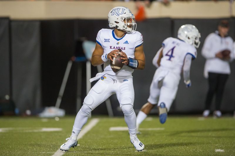 Oct 30, 2021; Stillwater, Oklahoma, USA;  Kansas Jayhawks quarterback Miles Kendrick (3) drops back to pass during the third quarter against the Oklahoma State Cowboys at Boone Pickens Stadium. Oklahoma State won 55-3. Mandatory Credit: Brett Rojo-USA TODAY Sports