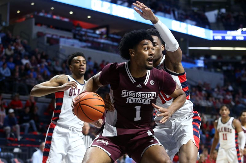 Feb 18, 2023; Oxford, Mississippi, USA; Mississippi State Bulldogs forward Tolu Smith (1) drives to the basket as Mississippi Rebels forward Theo Akwuba (10) defends during the first half at The Sandy and John Black Pavilion at Ole Miss. Mandatory Credit: Petre Thomas-USA TODAY Sports