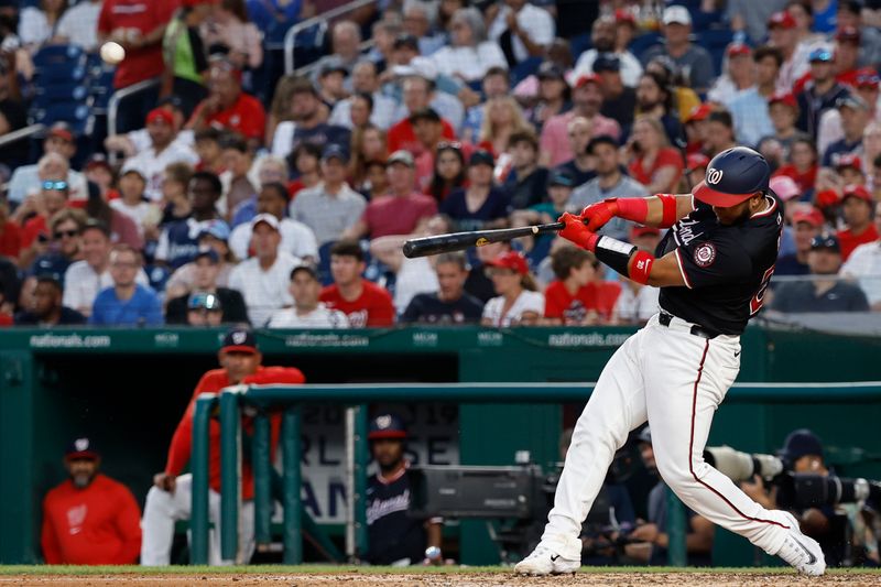May 24, 2024; Washington, District of Columbia, USA; Washington Nationals catcher Keibert Ruiz (20) hits a two run home run against the Seattle Mariners during the sixth inning at Nationals Park. Mandatory Credit: Geoff Burke-USA TODAY Sports
