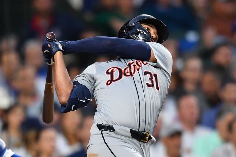 Aug 21, 2024; Chicago, Illinois, USA; Detroit Tigers designated hitter Riley Greene (31) hits a two-run home run during the second inning against the Chicago Cubs at Wrigley Field. Mandatory Credit: Patrick Gorski-USA TODAY Sports