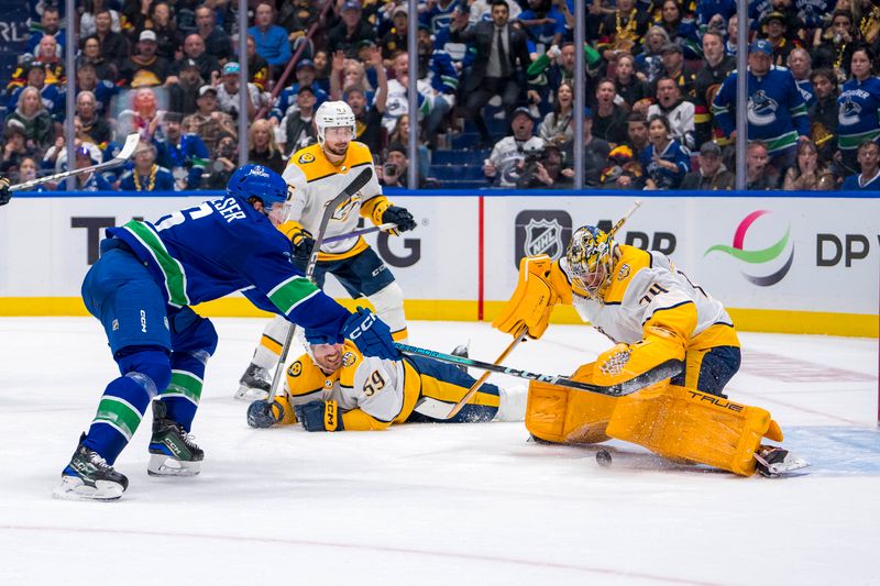 Apr 23, 2024; Vancouver, British Columbia, CAN; Nashville Predators goalie Juuse Saros (74) makes a save on Vancouver Canucks forward Brock Boeser (6) during the third period in game two of the first round of the 2024 Stanley Cup Playoffs at Rogers Arena. Mandatory Credit: Bob Frid-USA TODAY Sports