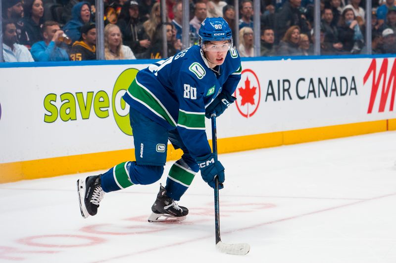 Sep 26, 2025; Vancouver, British Columbia, CAN; Vancouver Canucks forward Braeden Cootes (80) looks for the loose puck against the Seattle Kraken in the third period at Rogers Arena. Mandatory Credit: Bob Frid-Imagn Images