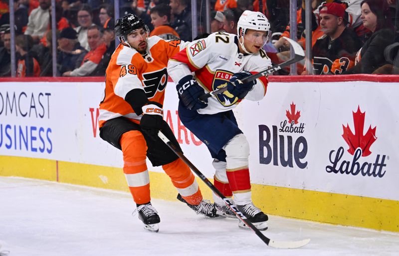 Mar 21, 2023; Philadelphia, Pennsylvania, USA; Philadelphia Flyers left wing Noah Cates (49) reaches across Florida Panthers defenseman Gustav Forsling (42) in the third period at Wells Fargo Center. Mandatory Credit: Kyle Ross-USA TODAY Sports