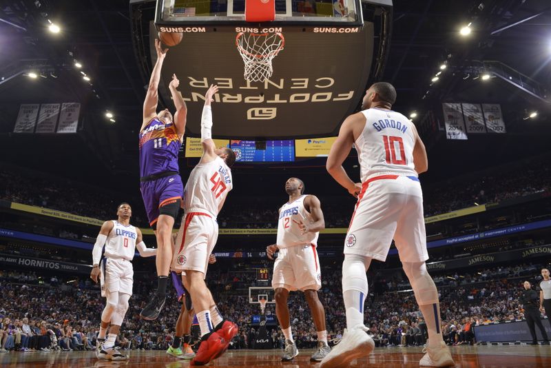 PHOENIX, AZ - APRIL 9: Jock Landale #11 of the Phoenix Suns shoots the ball during the game against the LA Clippers on April 9, 2023 at Footprint Center in Phoenix, Arizona. NOTE TO USER: User expressly acknowledges and agrees that, by downloading and or using this photograph, user is consenting to the terms and conditions of the Getty Images License Agreement. Mandatory Copyright Notice: Copyright 2023 NBAE (Photo by Barry Gossage/NBAE via Getty Images)