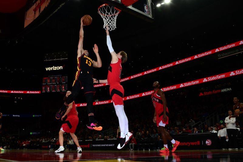 ATLANTA, GA - February 23:   Bogdan Bogdanovic #13 of the Atlanta Hawks drives to the basket during the game against the Toronto Raptors on February 23, 2024 at State Farm Arena in Atlanta, Georgia.  NOTE TO USER: User expressly acknowledges and agrees that, by downloading and/or using this Photograph, user is consenting to the terms and conditions of the Getty Images License Agreement. Mandatory Copyright Notice: Copyright 2024 NBAE (Photo by Scott Cunningham/NBAE via Getty Images)