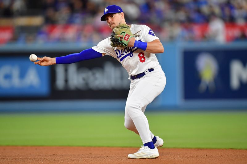 Apr 16, 2024; Los Angeles, California, USA; Los Angeles Dodgers second baseman Enrique Hernández (8) throws to first for the out against Washington Nationals second baseman Luis Garcia Jr. (2) during the seventh inning at Dodger Stadium. Mandatory Credit: Gary A. Vasquez-USA TODAY Sports