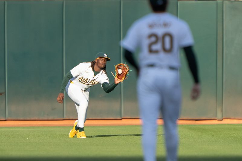 Jun 21, 2024; Oakland, California, USA; Oakland Athletics second base Zack Gelof (20) watches Oakland Athletics outfielder Lawrence Butler (4) catch the ball against the Minnesota Twins during the third inning at Oakland-Alameda County Coliseum. Mandatory Credit: Stan Szeto-USA TODAY Sports