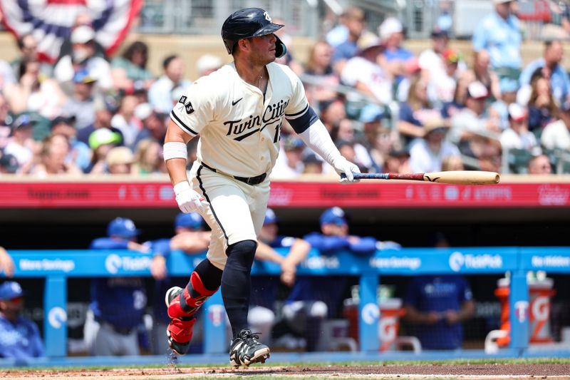 May 25, 2025; Minneapolis, Minnesota, USA; Minnesota Twins first baseman Ty France (13) hits an RBI single against the Kansas City Royals during the first inning at Target Field. Mandatory Credit: Matt Krohn-Imagn Images