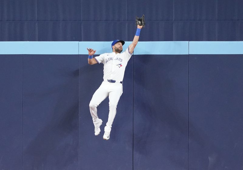 Jun 30, 2024; Toronto, Ontario, CAN; Toronto Blue Jays center fielder Kevin Kiermaier (39) catches a fly ball for the second out against the New York Yankees during the eighth inning at Rogers Centre. Mandatory Credit: Nick Turchiaro-USA TODAY Sports