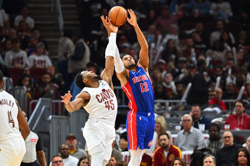 CLEVELAND, OHIO - OCTOBER 25: Donovan Mitchell #45 of the Cleveland Cavaliers and Tobias Harris #12 of the Detroit Pistons jump for a ball during the third quarter at Rocket Mortgage Fieldhouse on October 25, 2024 in Cleveland, Ohio. The Cavaliers defeated the Pistons 113-101. NOTE TO USER: User expressly acknowledges and agrees that, by downloading and or using this photograph, User is consenting to the terms and conditions of the Getty Images License Agreement. (Photo by Jason Miller/Getty Images)