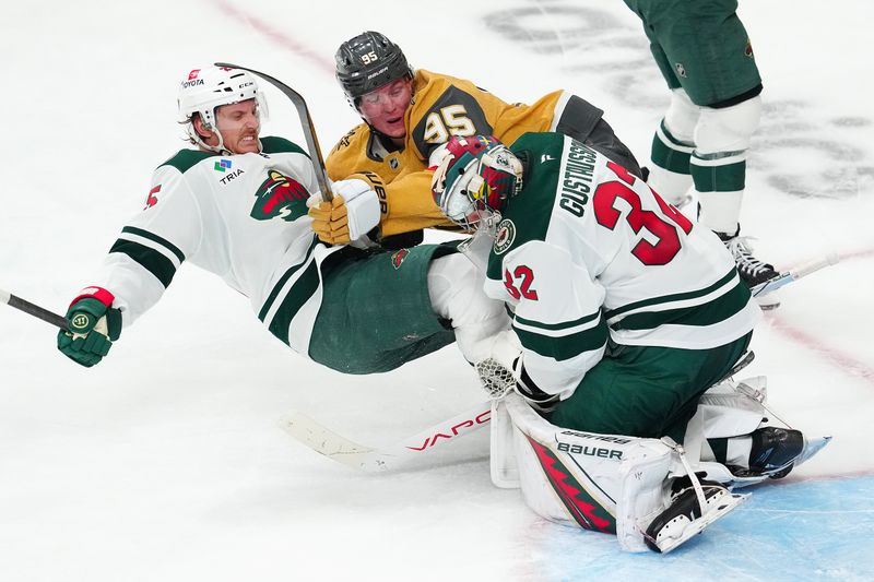Apr 22, 2025; Las Vegas, Nevada, USA; Minnesota Wild goaltender Filip Gustavsson (32) makes a save as Vegas Golden Knights right wing Victor Olofsson (95) and Minnesota Wild defenseman Jonas Brodin (25) fall to the ice during the third period of game two of the first round of the 2025 Stanley Cup Playoffs at T-Mobile Arena. Mandatory Credit: Stephen R. Sylvanie-Imagn Images