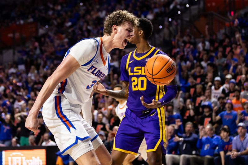 Feb 13, 2024; Gainesville, Florida, USA; Florida Gators center Micah Handlogten (3) reacts after a dunk against the LSU Tigers during the second half at Exactech Arena at the Stephen C. O'Connell Center. Mandatory Credit: Matt Pendleton-USA TODAY Sports