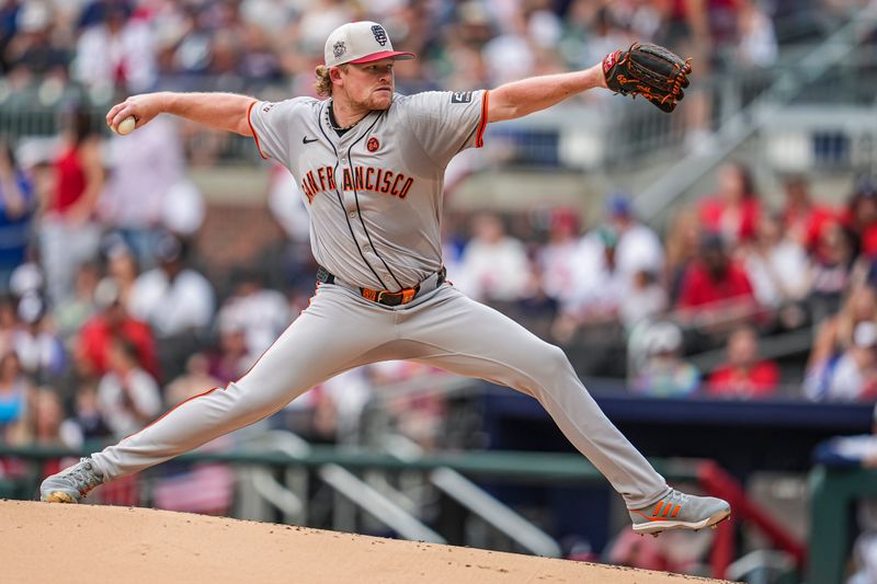 Jul 4, 2024; Cumberland, Georgia, USA; San Francisco Giants pitcher Logan Webb (62) pitches against the Atlanta Braves during the first inning at Truist Park. Mandatory Credit: Dale Zanine-USA TODAY Sports