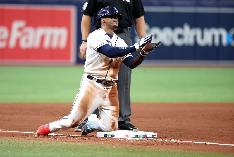 Aug 10, 2023; St. Petersburg, Florida, USA;  Tampa Bay Rays shortstop Wander Franco (5) celebrates after he hit s RBI triple  against the St. Louis Cardinals at Tropicana Field. Mandatory Credit: Kim Klement Neitzel-USA TODAY Sports