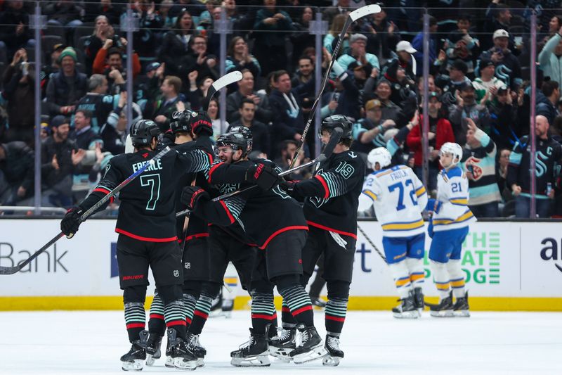 Mar 4, 2026; Seattle, Washington, USA; Seattle Kraken defenseman Vince Dunn (29) celebrates with teammates after scoring a goal in the third period against the St. Louis Blues at Climate Pledge Arena. Mandatory Credit: Kevin Ng-Imagn Images