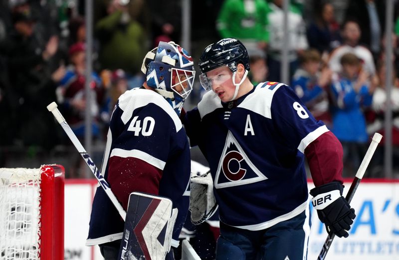 Feb 27, 2024; Denver, Colorado, USA; Colorado Avalanche goaltender Alexandar Georgiev (40) and defenseman Cale Makar (8) celebrate defeating the against the Dallas Stars at Ball Arena. Mandatory Credit: Ron Chenoy-USA TODAY Sports