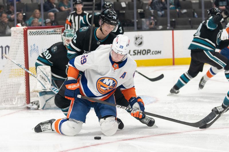 Mar 7, 2024; San Jose, California, USA; New York Islanders center Brock Nelson (29) keeps San Jose Sharks left wing William Eklund (72) away from the puck during the third period at SAP Center at San Jose. Mandatory Credit: Stan Szeto-USA TODAY Sports