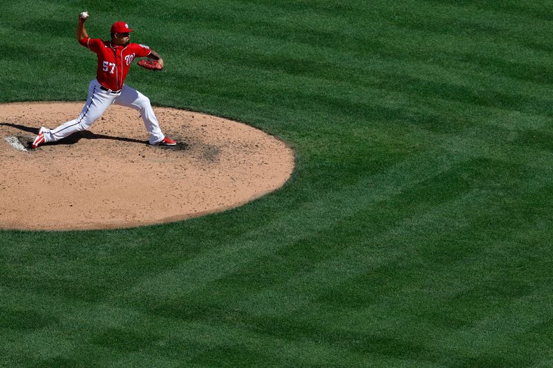 Aug 13, 2023; Washington, District of Columbia, USA; Washington Nationals relief pitcher Andres Machado (57) pitches against the Oakland Athletics during the seventh inning at Nationals Park. Mandatory Credit: Geoff Burke-USA TODAY Sports