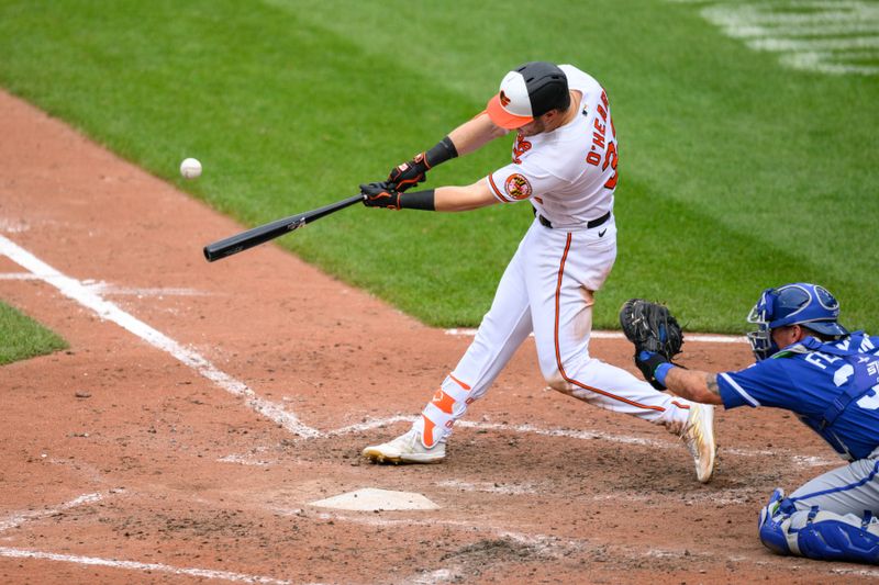 Jun 11, 2023; Baltimore, Maryland, USA; Baltimore Orioles first baseman Ryan O'Hearn (32) hits a home run during the eighth inning against the Kansas City Royals at Oriole Park at Camden Yards. Mandatory Credit: Reggie Hildred-USA TODAY Sports