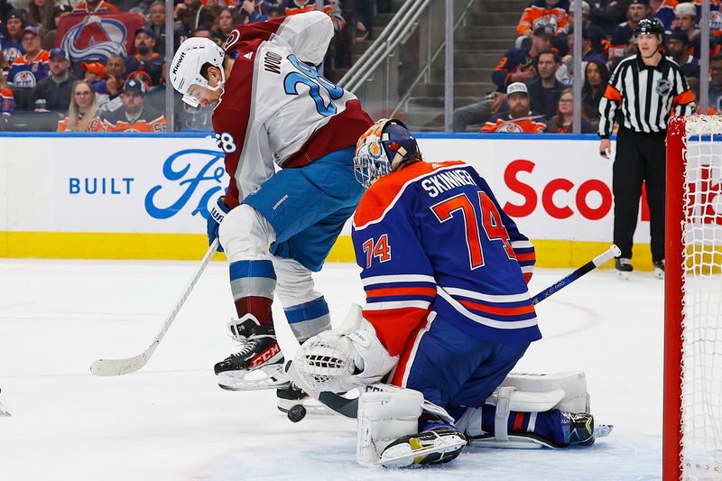 Mar 16, 2024; Edmonton, Alberta, CAN; Colorado Avalanche forward Miles Wood (28) deflects a shot on Edmonton Oilers goaltender Stuart Skinner (74) during the second period at Rogers Place. Mandatory Credit: Perry Nelson-USA TODAY Sports